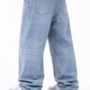 Back view of men’s light blue oversized fit denim jeans with relaxed streetwear style and casual white-blue sneakers.