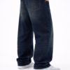 Back view of men’s dark blue oversized fit denim jeans with relaxed streetwear style and casual sneakers.