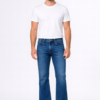 Men wearing classic blue bootcut denim jeans with white t-shirt full body studio shot